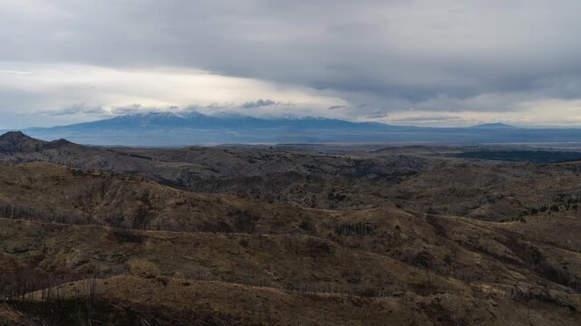 Clouds moving over Crazy Mountains range timelapse 