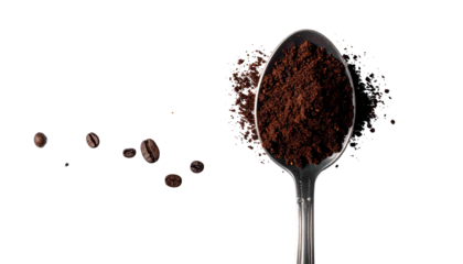 A metallic spoon brimming with ground coffee, beans scattered, all against a dark background
