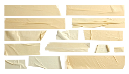 Scattered strips of tan, torn adhesive tape on black background. Edges show details