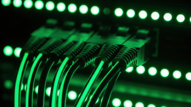 Network Infrastructure Connectivity: High-speed fiber optic ethernet cables with glowing green lights in server room data center - Powered by Adobe