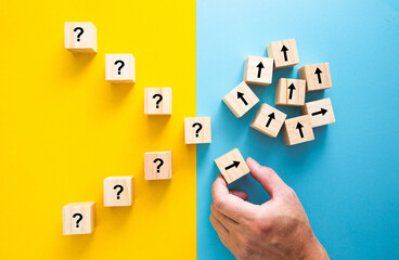 Hand moving blocks from questions to answers