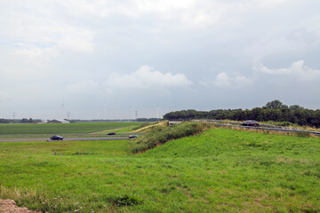 Obraz premium Drone view of meadows and roads at the reclaimed land of Flevoland