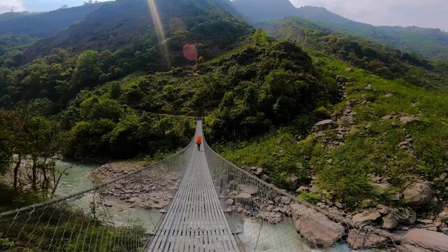 Crossing the first suspension bridge in the Kanchenjunga region.