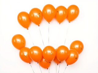A bunch of orange balloons floating in the air on a white background