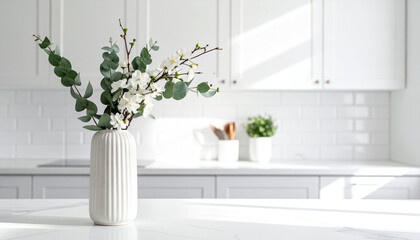 Bright kitchen interior with white vase of flowers and eucalyptus branches