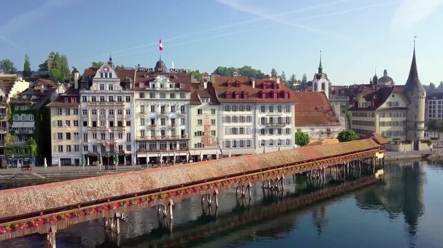 Aerial summer view of Lucerne with Chapel Bridge old town and birds in flight