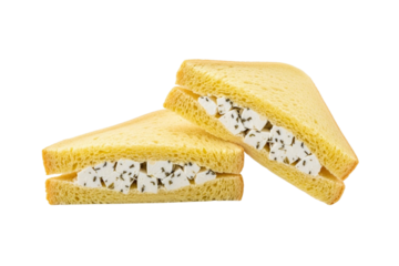 Two triangle-cut sandwiches with feta cheese and herbs isolated on transparent background