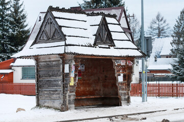 WITOW, POLAND - DECEMBER 26, 2025: Vintage bus stop on a country road in winter.