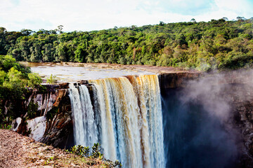 Kaichur waterfall with a beautiful stream of water on a clear sunny day in the middle of the jungle, Guyana. Subtropics, world tourism.