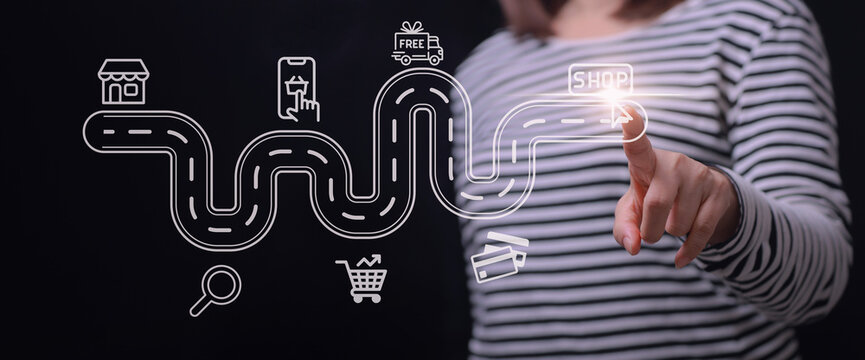 Confident woman touching virtual map visualizing online retail customer journey concept