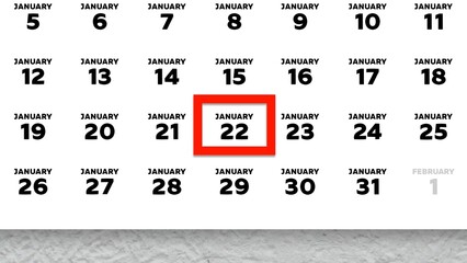 Close-up of the date January 22nd marked with a red cursor on the wall calendar 2026