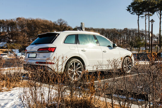 December 18, 2020, Seoul, South Korea - A white Audi Q7 50 TDI luxury SUV parked in an outdoor lot on a sunny winter day.