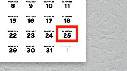 Close-up of the date January 25th marked with a red cursor on the wall calendar 2026