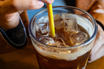 iced coffee with a yellow straw