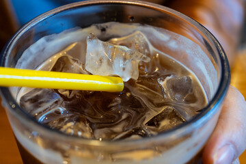 iced coffee with a yellow straw