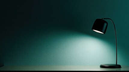 A modern table lamp with adjustable neck emits soft white light against a textured teal wall,
