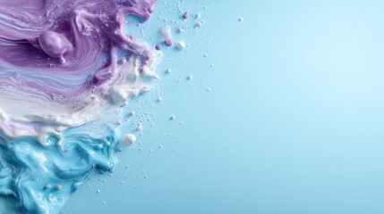 A captivating abstract composition featuring a swirl of vibrant colors and paint splatters against a calming blue canvas, evoking creativity and artistic expression.