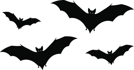 Fototapeta premium Four black bats flying in different directions