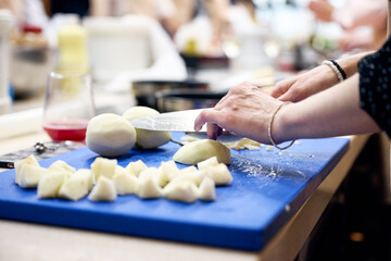 woman hands kneading dough