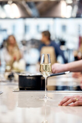 waiter pouring wine in restaurant