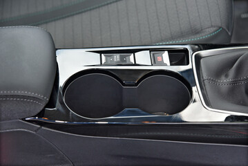 Cup holder between the front seats in the car