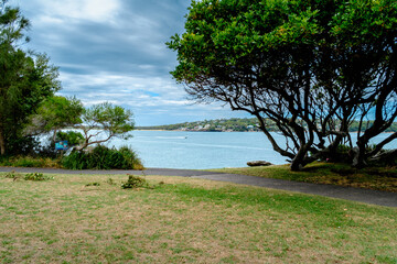 Taken at Hungry Point Reserve on the Cliff Top Walk in December 2025, this photo shows the coastline views toward Bundeena and Maianbar, with people enjoying hiking and coastal life.