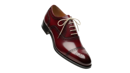 Isolated oxblood brogue shoe with ivory laces sitting at an angle showing the shoe's side profile