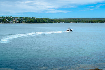 Taken at Hungry Point Reserve on the Cliff Top Walk in December 2025, this photo shows the coastline views toward Bundeena and Maianbar, with people enjoying hiking and coastal life.