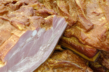 Smoked pork belly or brisket on the counter of a butcher shop
