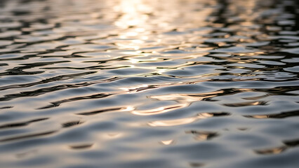 Golden Sunlight Reflecting on Calm Water Ripples at Sunset