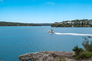 Taken at Hungry Point Reserve on the Cliff Top Walk in December 2025, this photo shows the coastline views toward Bundeena and Maianbar, with people enjoying hiking and coastal life.
