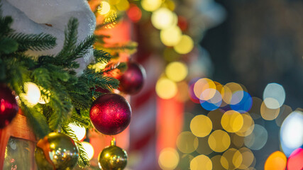 Christmas tree decorated with red and gold ornaments and festive lights
