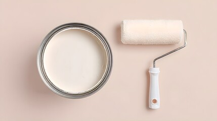 White paint can sits on a table next to a paint roller. Concept of readiness and preparation for a painting project