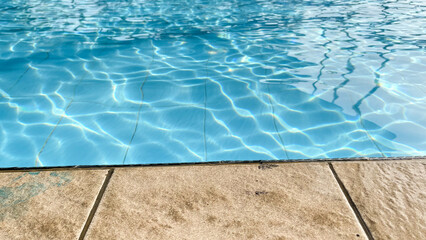 Obraz premium Poolside Edge Detail with Calm Water