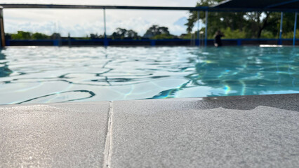 Poolside Edge Detail with Calm Water