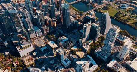 Footage high over Austin downtown, Texas, USA on sunny day. Approaching the Colorado River flowing through the city.