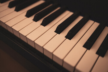 Fototapeta premium Upright piano details in cozy indoor night lighting