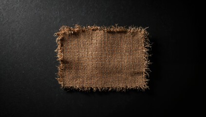 Rough linen jute sackcloth isolated on black background, useful as natural textile backdrop, World Environment Day