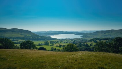Fototapeta premium Panoramic view from Hamsfell summit showcasing southern Lake District topography, suitable for outdoor activity backgrounds