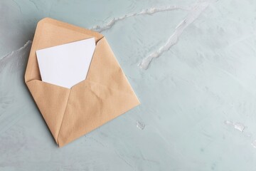 A voting ballot is partially visible inside an envelope placed on a flat surface. This scene shows preparation for a voting process during the election period