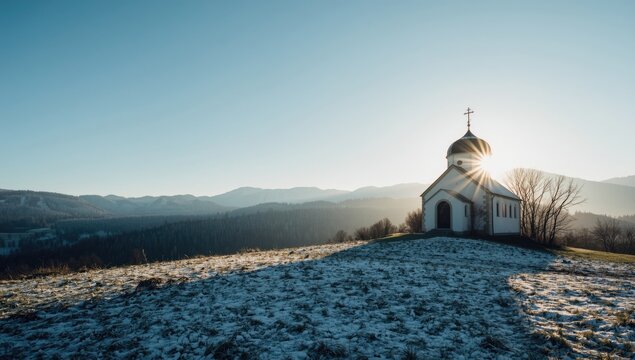 European alpine landscape featuring a Bavarian church with snow, mountain backdrop, trees, grass, winter setting, seasonal preservation - Powered by Adobe