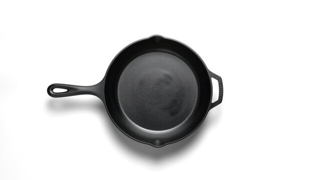 High-angle shot of a cast iron skillet with a clean surface for culinary presentation or instructional use