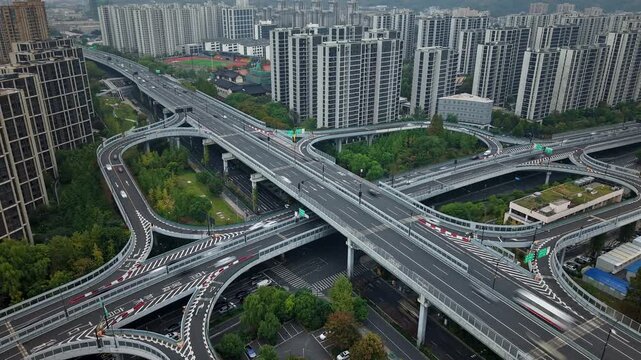 Traffic and cityscape timelapse of Hangzhou, China, showing busy highways and residential buildings