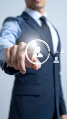 Businessman touching virtual screen with human resources icon, symbolizing recruitment and talent acquisition in a professional setting.