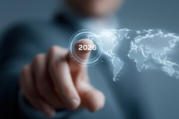 Executive selects glowing 2026 interface over digital world map projection.​