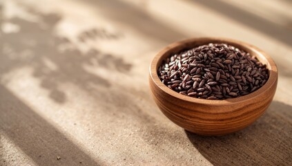 Uncooked wild rice served in a bowl on wooden background, highlighting grain quality for healthy diets
