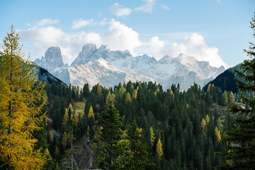 Mountain Plateau Landscape Scene - Prato Piazza Dolomites Italy - Autumn Fall Alpine rolling hills with forests and golden trees - castles, roads and mountains 
