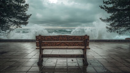 Vacant park seat overlooking turbulent ocean in coastal village during stormy weather, highlighting erosion concerns