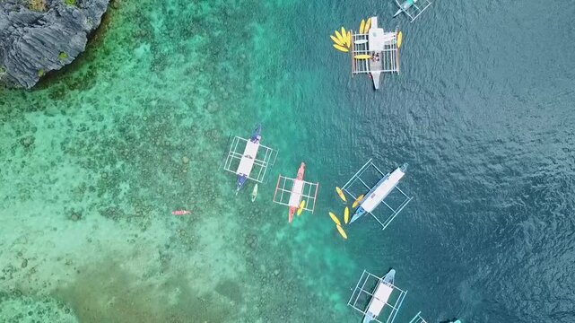 Philippine boats on idyllic beaches in the Philippines on a sunny day, aerial footage recorded with a drone in FHD 1080 50fps H.264