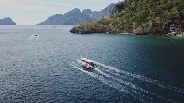Philippine boats on idyllic beaches in the Philippines on a sunny day, aerial footage recorded with a drone in FHD 1080 50fps H.264